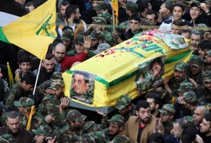 Members of Lebanon's militant Shiite Muslim movement Hezbollah carry the coffin of Lebanese militant Samir Kantar, who was killed in a suspected Israeli air-raid on his home in the Jaramana district on the outskirts of the Syrian capital Damascus, during his funeral procession in a southern suburb of the Lebanese capital Beirut on December 21, 2015. Israel's justice minister welcomed the death of Kantar but did not claim credit for the air strike in Syria that killed him, which Hezbollah said was an Israeli raid. AFP PHOTO / ANWAR AMRO / AFP / ANWAR AMRO